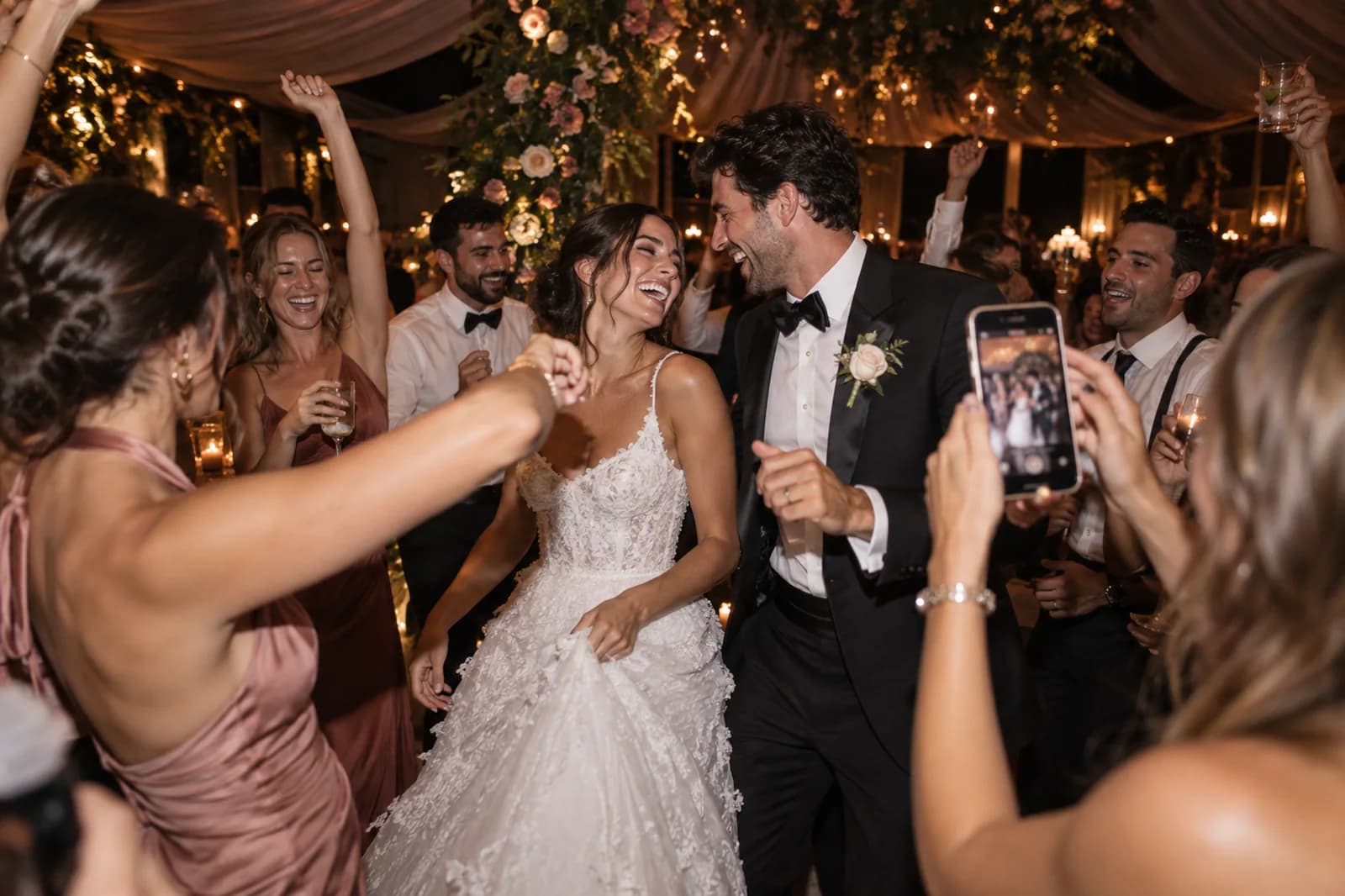 Friends cheering the couple on the dance floor