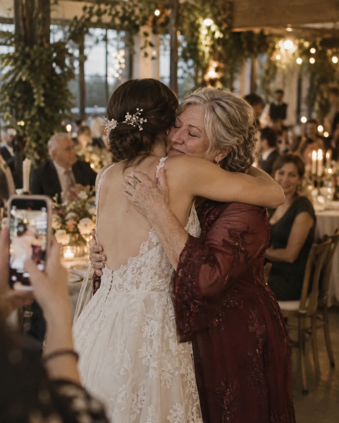 A guest hugging the bride
